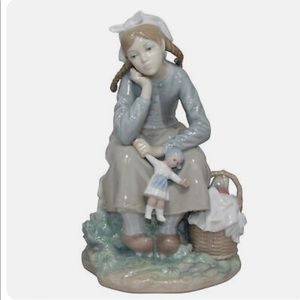 Lladro Spanish porcelain. Girl with doll.